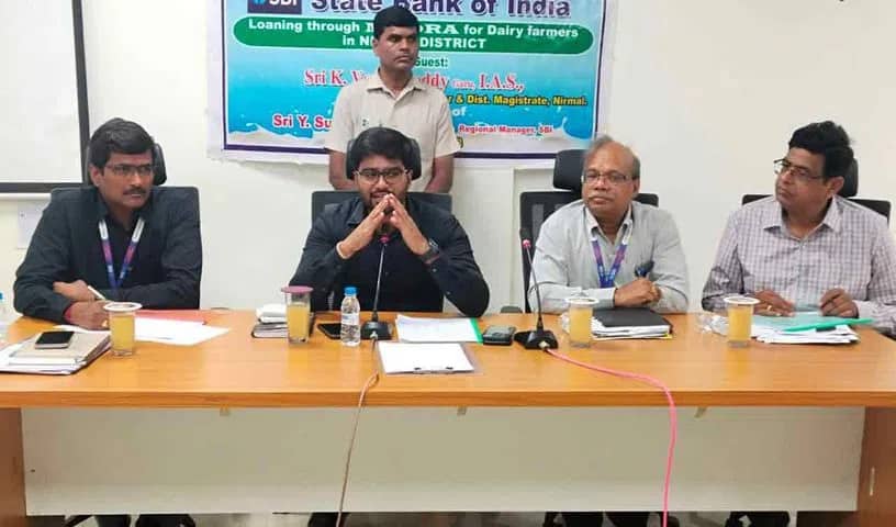 Collector Varun Reddy convenes a meeting with bankers and officials of various departments in Nirmal on Tuesday.