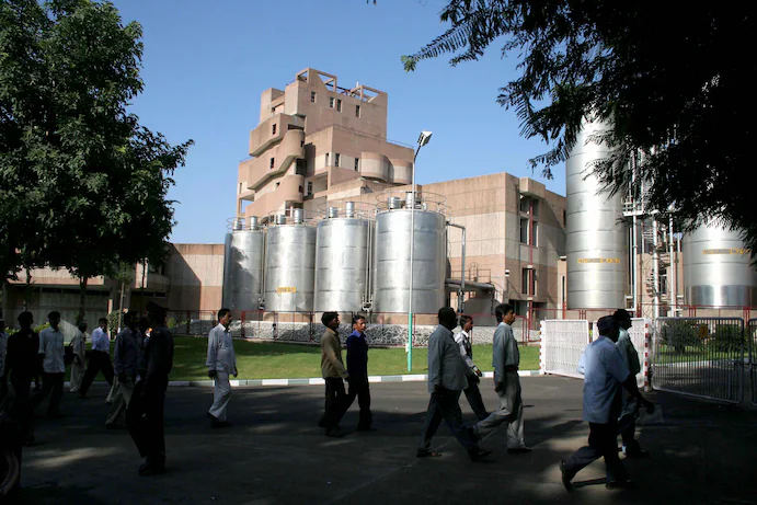 Visitors walk the grounds of the Amul Dairy Plant in Anand, India. (Sam Panthaky/AFP/Getty Images)