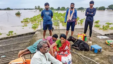 Andhra Pradesh floods Scores scramble for food, milk in Vijayawada