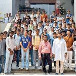 Engineering students examine advanced dairy automation